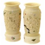 A pair of Japanese Meji Period ivory and Shibayama vases, each carved to depict battle scenes with