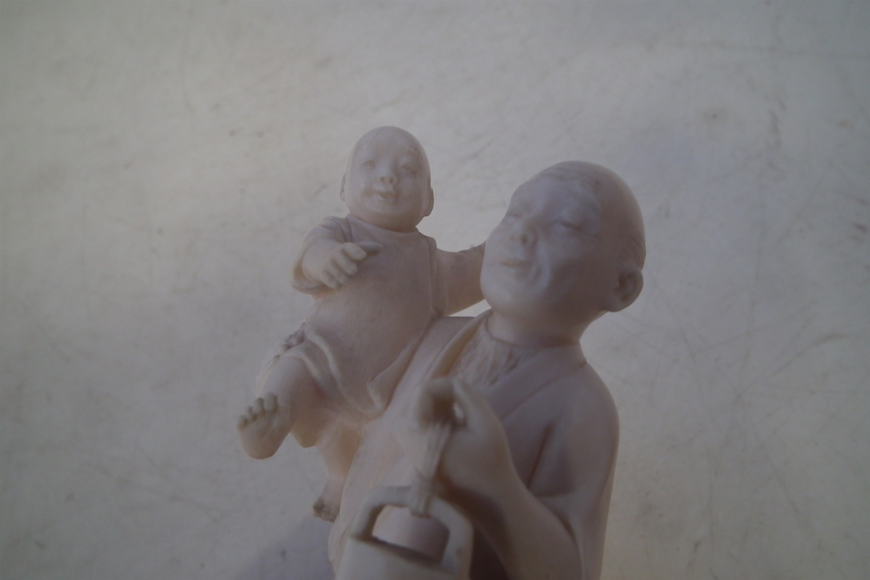 Japanese Ivory okimono, depicting a father and his two sons carrying a lantern with a dog at the - Image 9 of 11