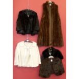 Four fur coats and a stole. We are unable to do condition reports on our Interiors Sale
