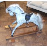 Wooden grey rocking horse. We are unable to do condition reports on our Interiors Sale