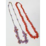 Two necklaces, to include an early 20th century glass bead necklace and a coral necklace. We are