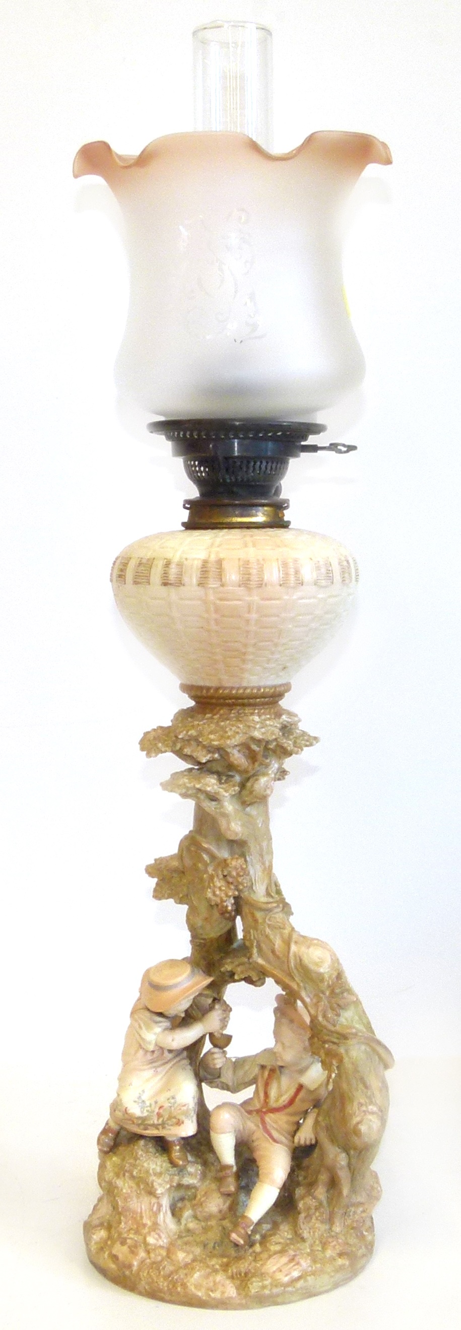 Royal Worcester oil lamp with two figures of children sat at the base We are unable to do