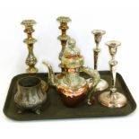 A pair of Sheffield plated candlesticks, a pair of copper and embossed plated candlesticks, Middle