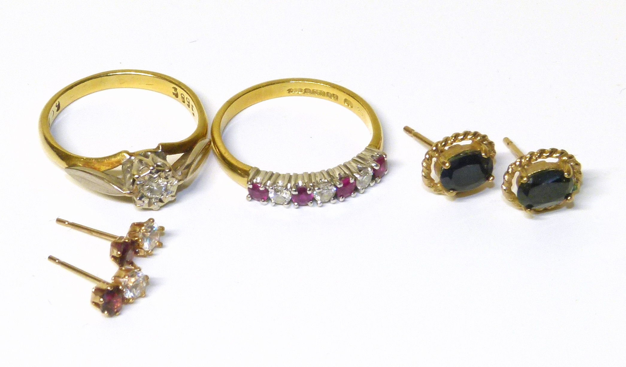 A selection of jewellery, to include an 18ct gold diamond and ruby band ring, an 18ct gold diamond