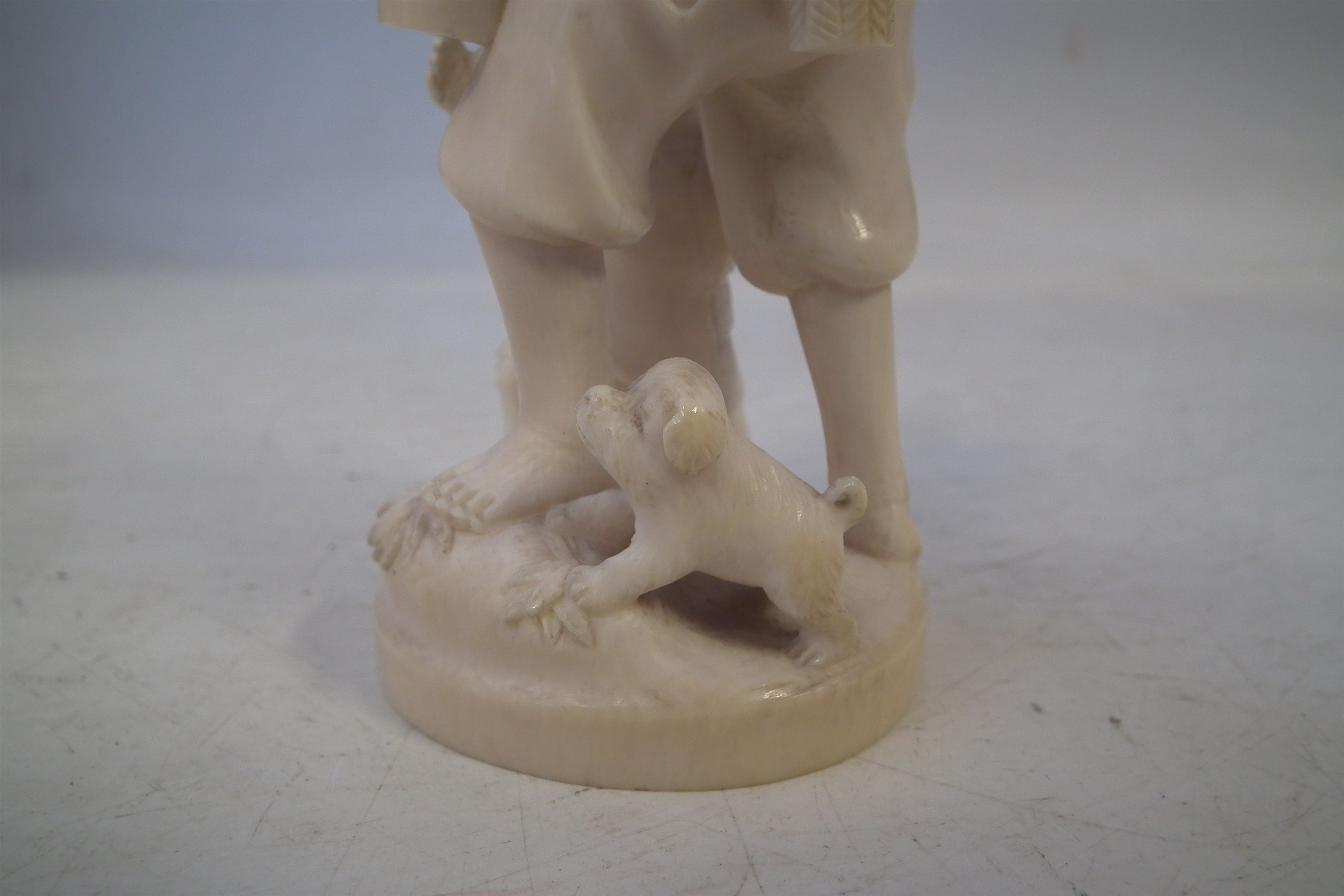 Japanese Ivory okimono, depicting a father and his two sons carrying a lantern with a dog at the - Image 6 of 11