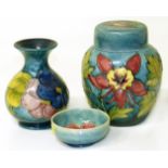 Moorcroft ginger jar, vase and a pin dish. We are unable to do condition reports on our Interiors