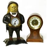 Cast iron clock and a balloon clock We are unable to do condition reports on our Interiors Sale