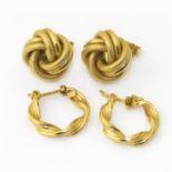 Two pairs of 9ct gold earrings, to include a pair of plain hoops and a pair of studs, gross weight