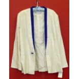 A Norman Hartnell jacket, cream with blue lapel. We are unable to do condition reports on our