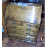 Reproduction oak fall-front bureau, 76cm wide with fitted interior. We are unable to do condition
