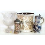 Bretby jardinier with embossed Cherub all round decoration, two German pottery steins and a cut