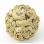 A Japanese Meiji Period ivory monkey ball, signed, diameter 6cm. We are unable to do condition