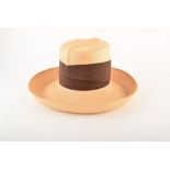 A Philip Treacy straw hat, with brown ribbon banding. We are unable to do condition reports on our