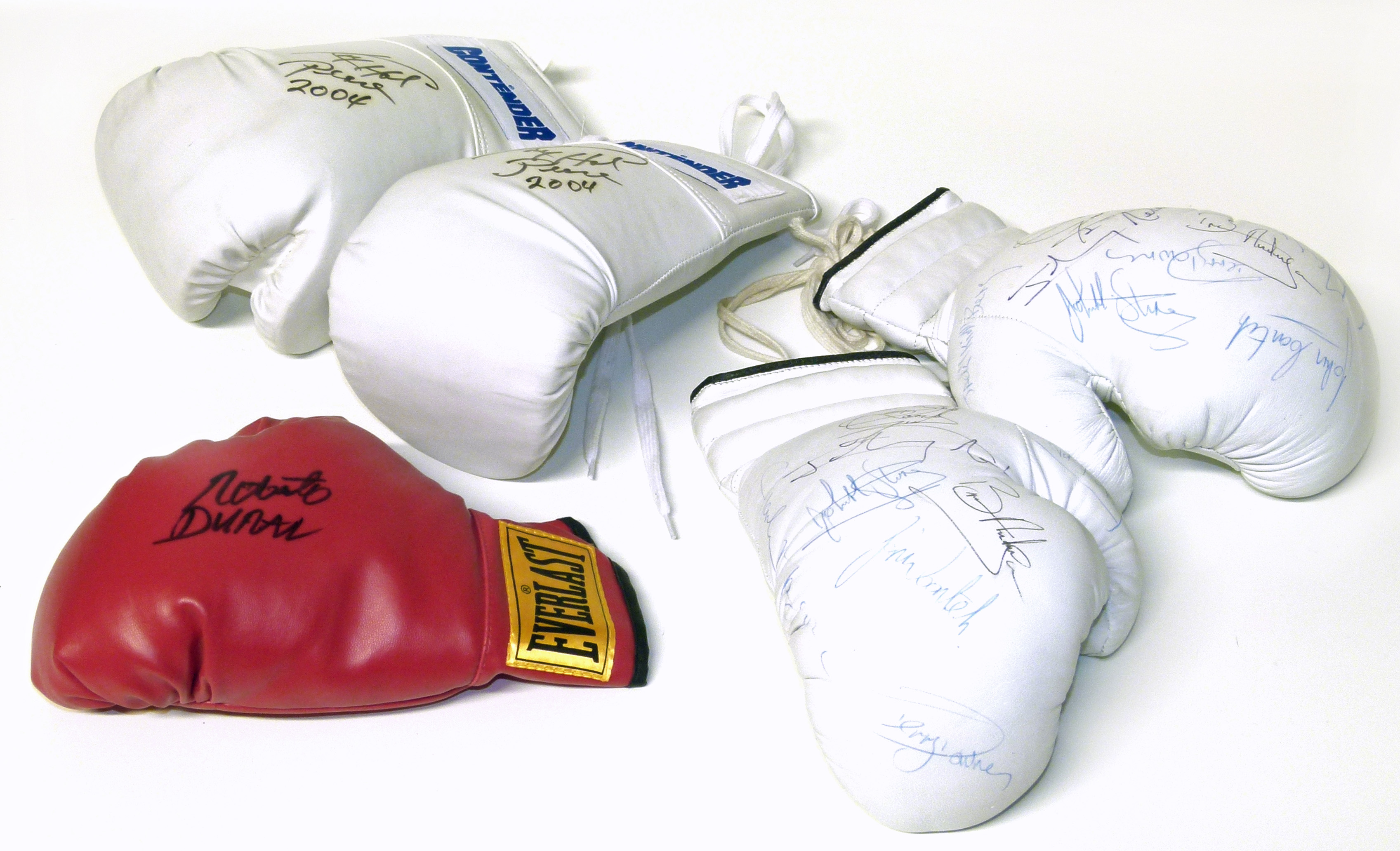 Five autographed boxing gloves, bearing signatures of Roberto Duran, Jack (Kid) Berg, John Conteh,