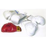 Five autographed boxing gloves, bearing signatures of Roberto Duran, Jack (Kid) Berg, John Conteh,