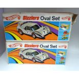 Two boxed Hot Wheels Sizzlers oval sets We are unable to do condition reports on our Interiors Sale