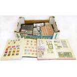 All world stamps in two albums, stockbook, cards and in packets. Includes issues from Africa, Asia