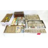 A large collection of cigarette cards in cartons, tins, and loose We are unable to do condition