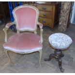 Victorian walnut revolving piano stool and French style open armchair. Condition reports are not