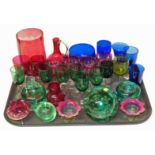 Collection of Victorian coloured glass ware including dump paperweight and ink bottles. Condition
