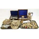 A selection of silver and white metal items to include silver flatware, silver jar lids and other