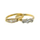 Two diamond dress rings, to include a diamond three stone ring stamped 18ct, and an Edwardian 18ct