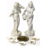 A pair of Schoop white painted figure of young robed ladies carrying water and 6 small Poole