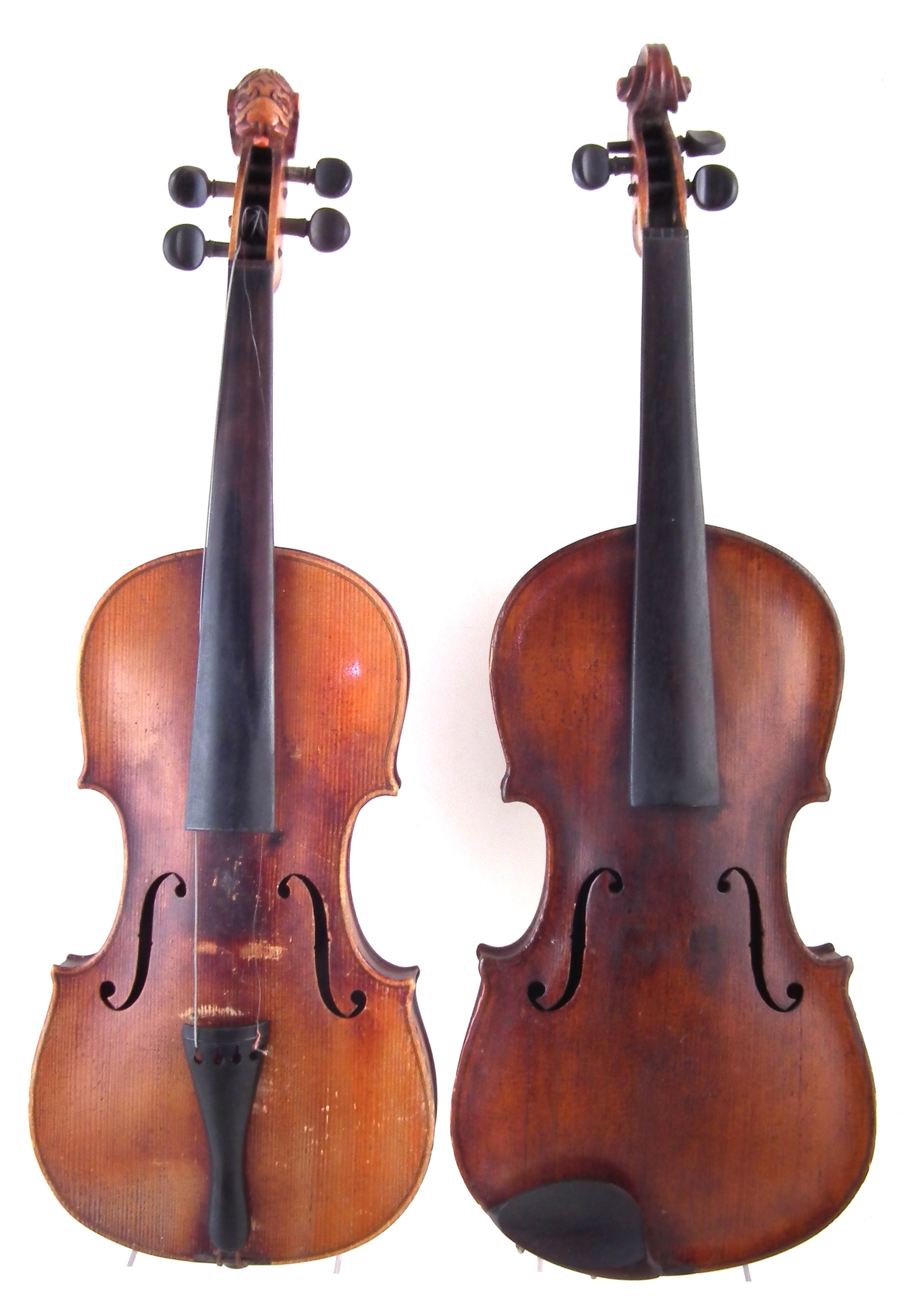 German lion head scroll violin together with one other violin, both with cases.