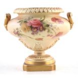 Royal Worcester twin handled pedestal bowl , decorated with flowers on a blush ivory ground, date