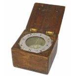 A cased compass from a Lancaster Bomber which was forced to land after being shot (story to bottom