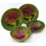 Four Moorcroft Hibiscus bowls. Condition reports are not available for our Interiors Sale