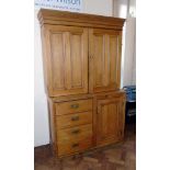 Victorian pine two door cabinet on base enclosing cupboard and four drawers. Condition reports are