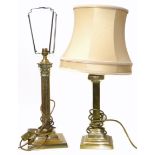 Two brass Corinthian column lamp bases. Condition reports are not available for our Interiors Sale