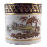 Derby Porter mug, painted with a landscape below a blue and gilt border, 13cm high Some