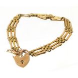 A bracelet, the gate link chain with heart shape padlock clasp, stamped 9ct, gross weight 10.7g.