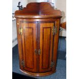 George III oak and cross-banded corner cupboard. Condition reports are not available for our