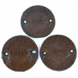 3 circular cast iron wagon plate plaques, inter repair 5459, 1975, 1976 and one unclear date