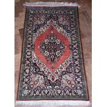 Iranian Qum silk rug, pink ground central medallion, cobalt blue spandrels, single repeating