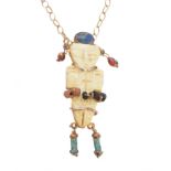 A vari-gem pendant, designed as a figure, with carved bone body, faience legs, and lapis lazuli