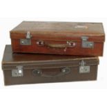Two leather and compressed fibre suitcases. Condition reports are not available for our Interiors