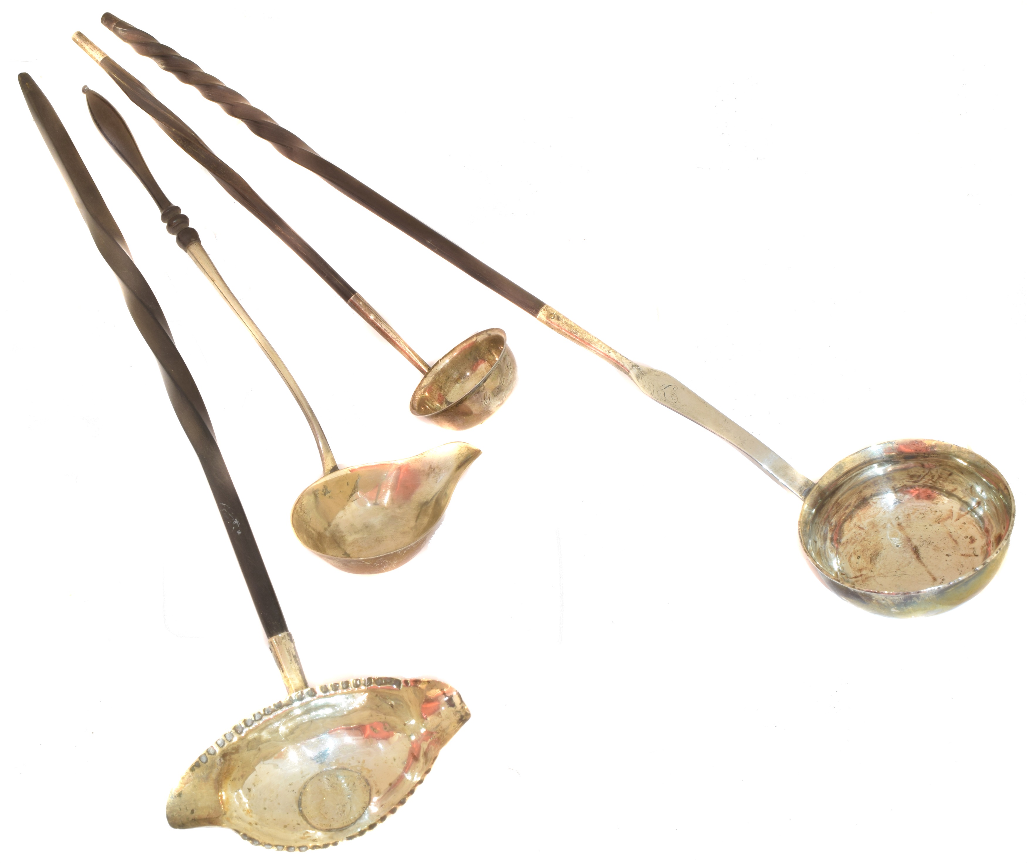 Four Georgian and later toddy ladles,