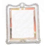 An Edward VII silver fronted frame,