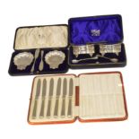 Three sets of Victorian and later cased silver cutlery,