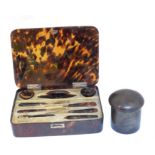 An early 20th Century silver and tortoiseshell vanity case,