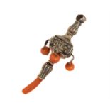 An Edwardian silver and coral rattle,