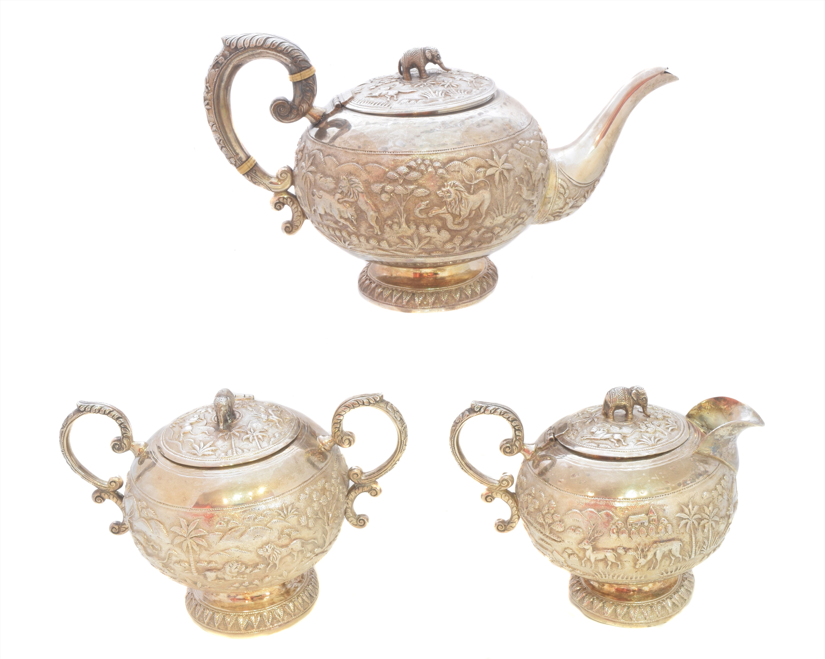 An Indian white metal three piece tea set,