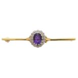 An amethyst and diamond brooch,