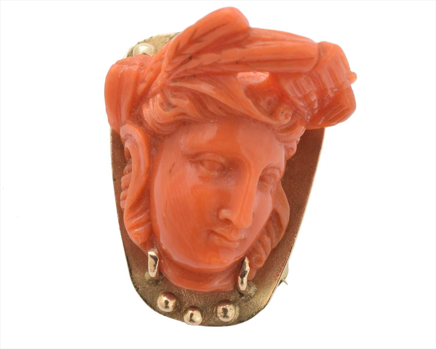 A coral brooch,