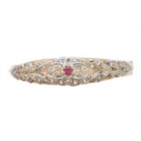 A ruby and diamond hinged bangle,