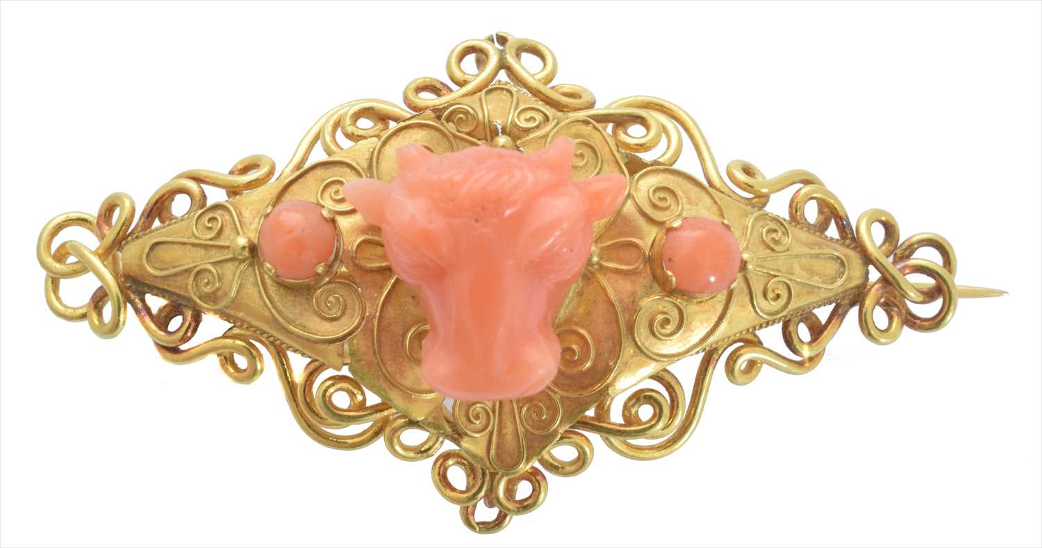 A coral brooch,